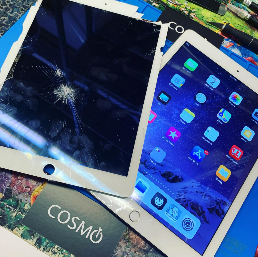 Broken tablet screens on a blue background, one cracked and one showing a home screen with app icons.