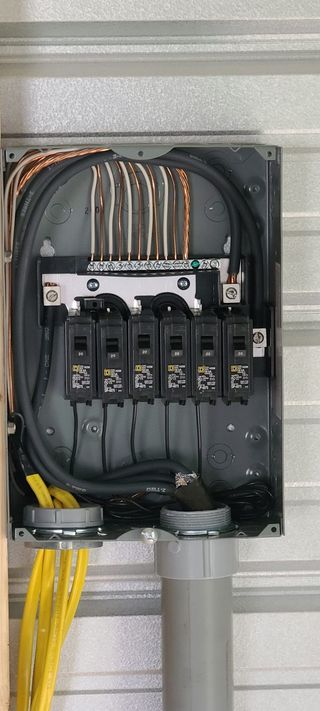 A close up of an electrical box on a wall.