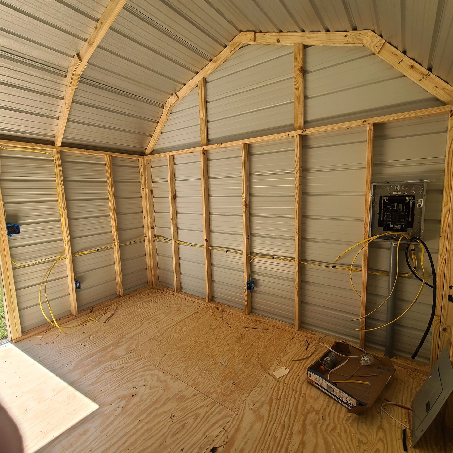 The inside of a shed with a box on the floor