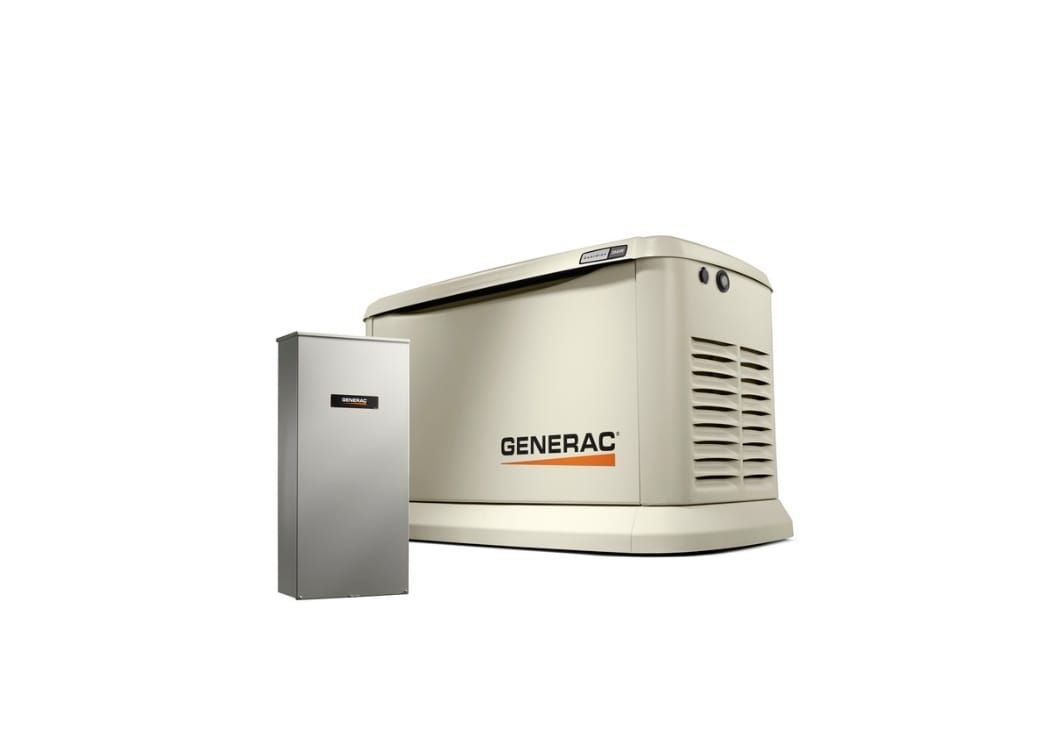 A generator is sitting next to a battery on a white background.