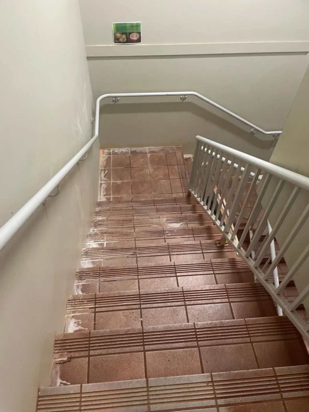 A Staircase With a White Railing and Tiled Steps Leading Up to the Second Floor — Doobies Cleaning Service in South West Rocks, NSW