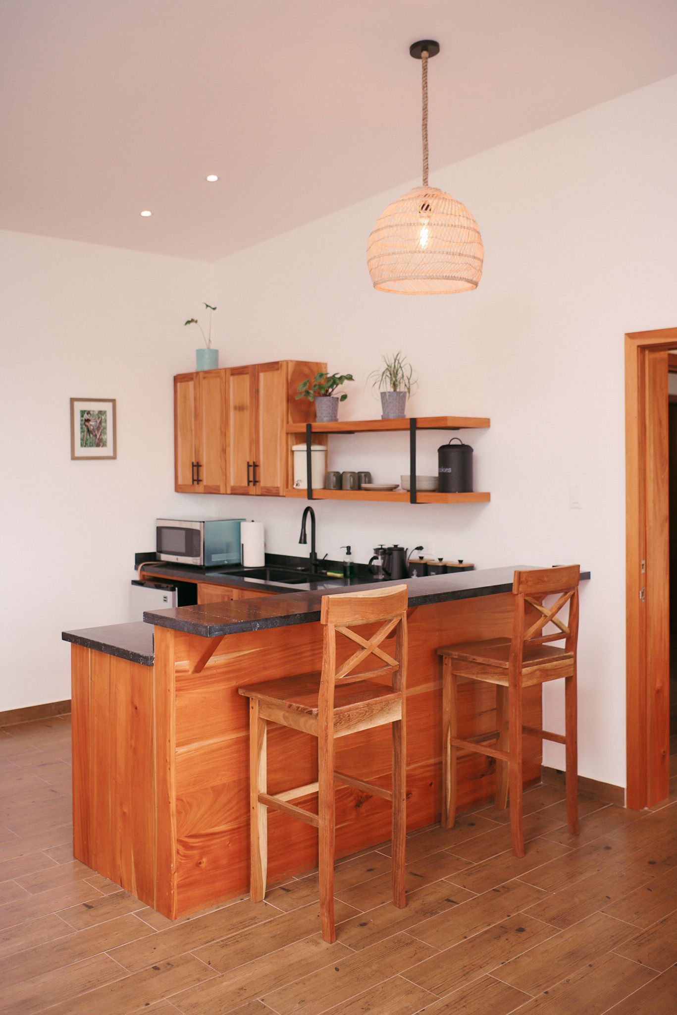 a kitchen with a wooden island and stools