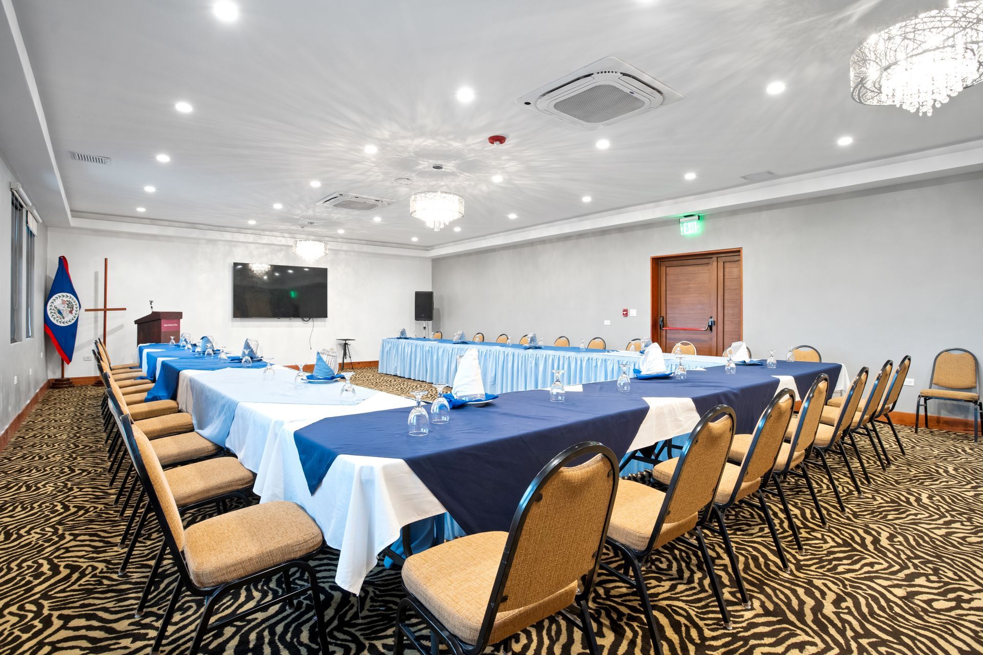 A large conference room with tables and chairs set up for a meeting.