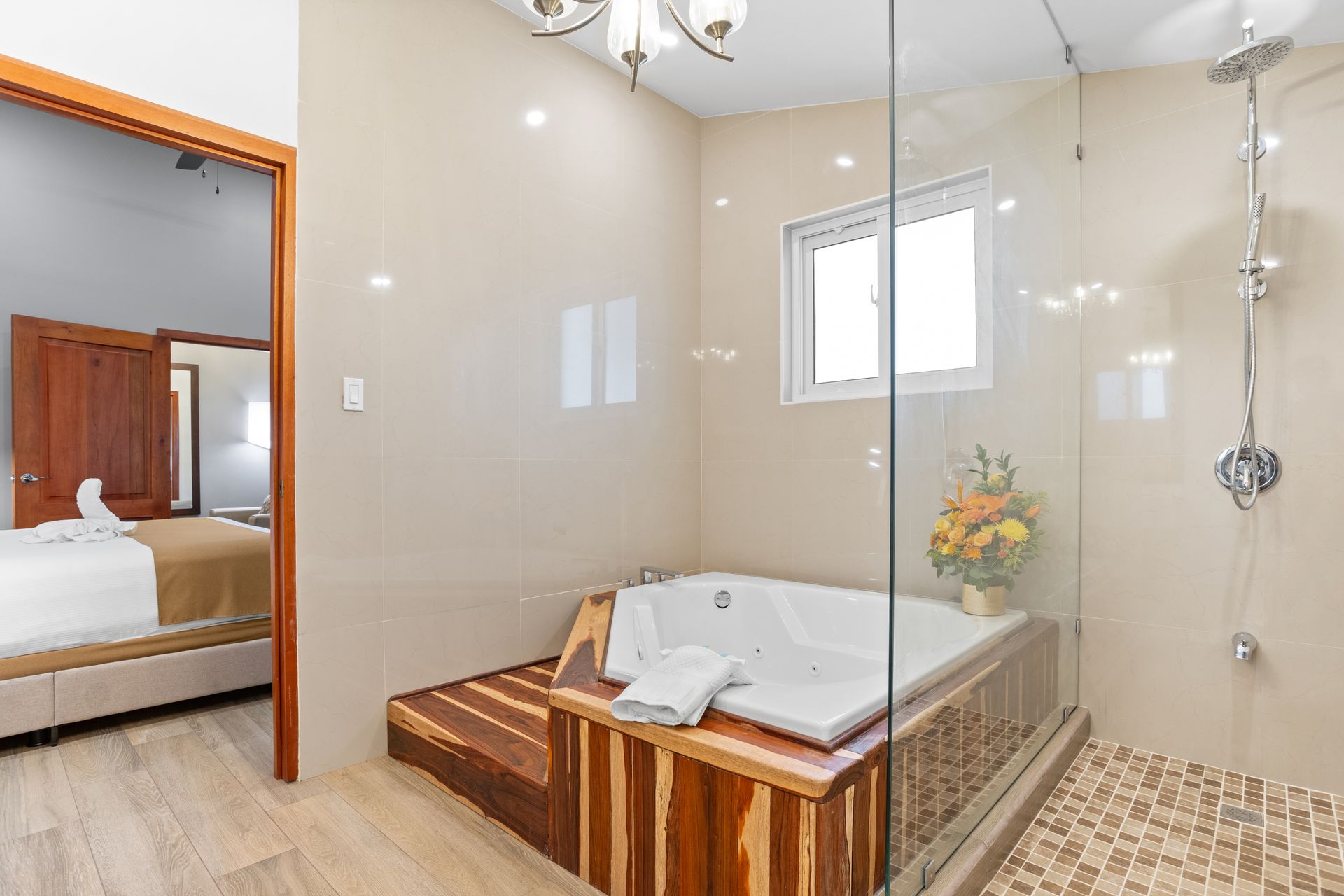 A bathroom with a jacuzzi tub and a walk in shower.