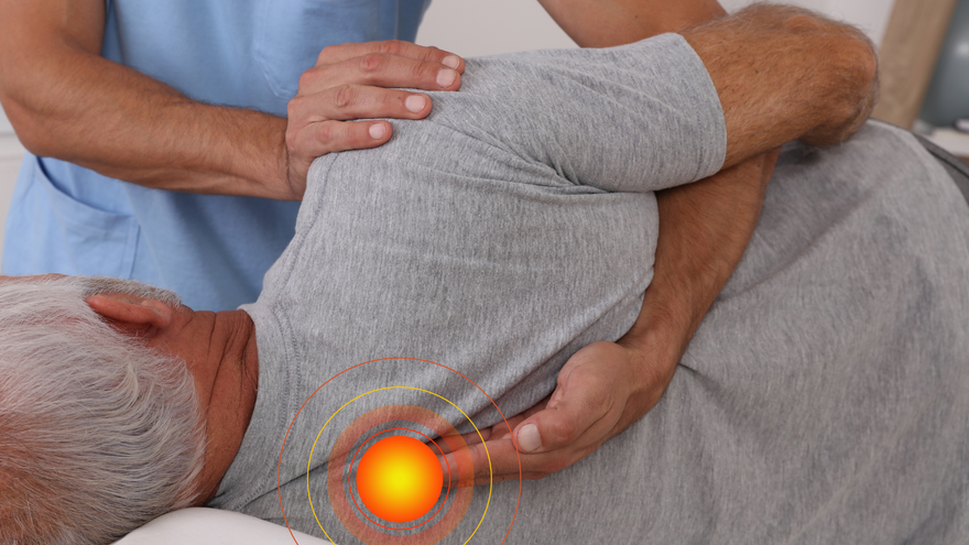 A healthcare professional performs a manual physical therapy adjustment on a patient's upper back, focusing on a sore area.