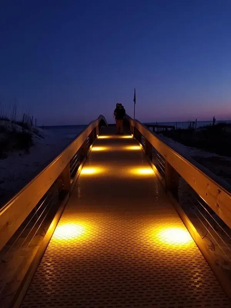 A bridge that is lit up at night