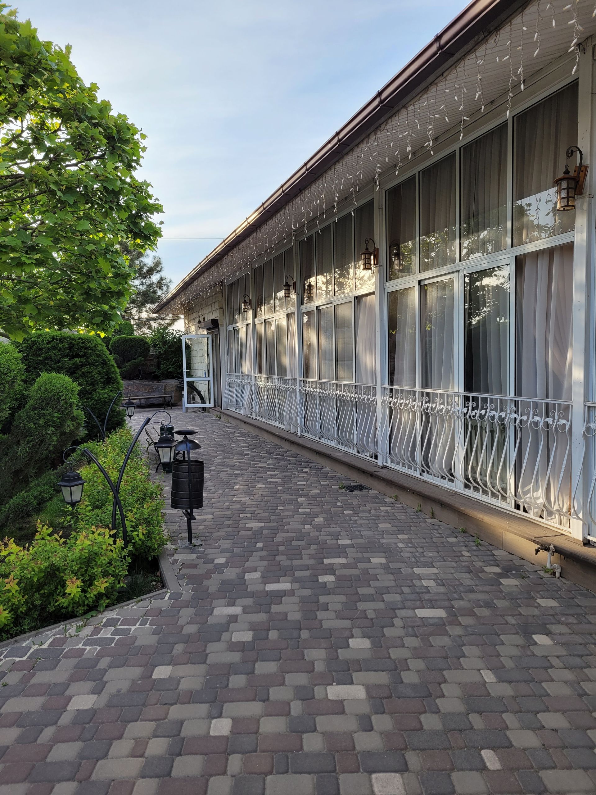 Interlocking patio in front of a house.