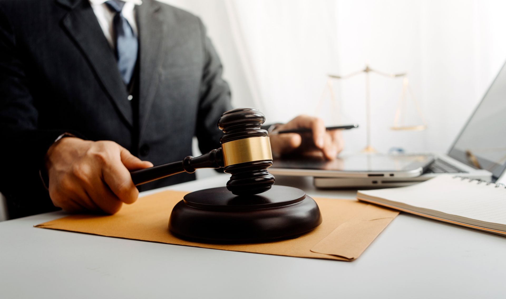 Person writing on Chapter 11 bankruptcy document with a blue pen. Person writing on Chapter 11 bankruptcy document with a blue pen.