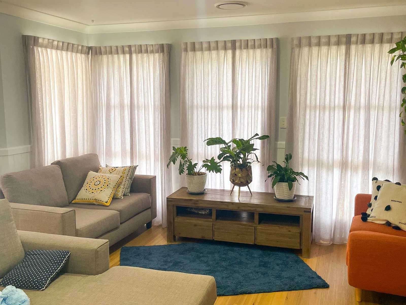 Living Room With A Couch, Chair, Table And Plants — Creative Curtains & Blinds In Tweed Heads South, NSW