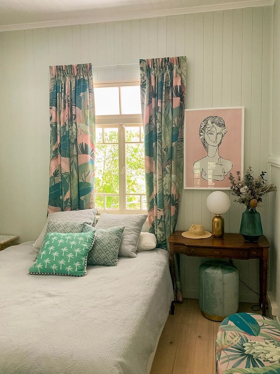 Bedroom With A Bed, A Table, And A Painting On The Wall — Creative Curtains & Blinds In Tweed Heads South, NSW