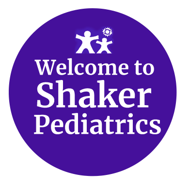 A purple circle that says welcome to shaker pediatrics