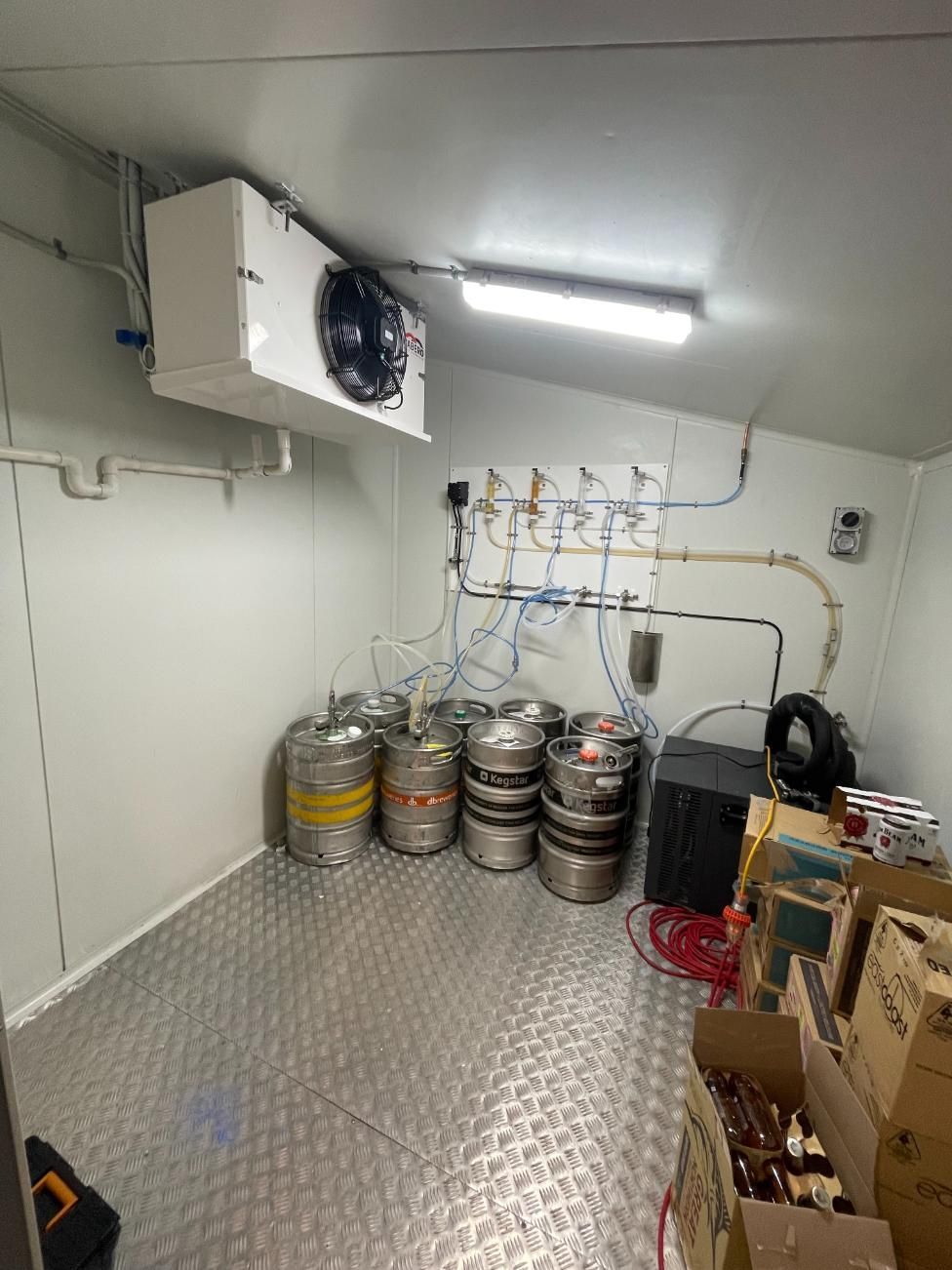 A Room Filled With Lots of Kegs and Boxes — Condie Refrigeration & Air Conditioning In Tweed, NSW