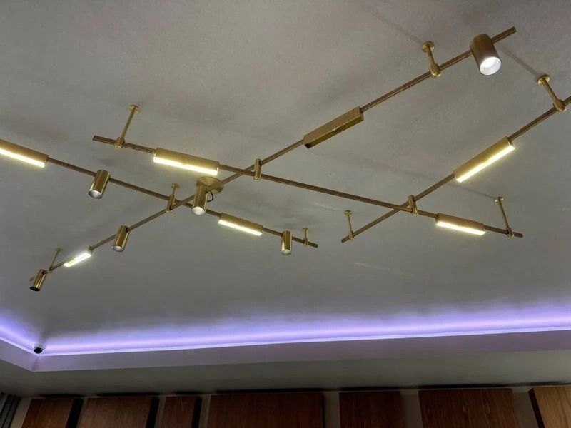 A ceiling with a lot of lights hanging from it