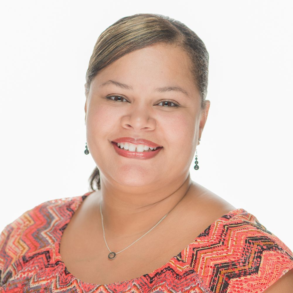 The D5 Group Business Headshot of an beautiful bi-racial woman. African-American Male Professional
