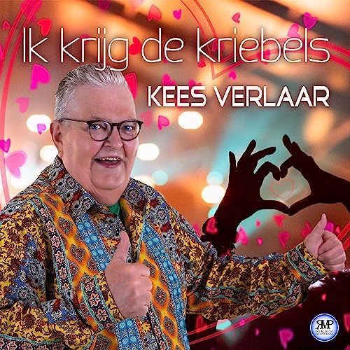 Kees Verlaar smiling and giving thumbs up with pink hearts and title text “Ik krijg de kriebels”