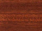 A close-up texture of dark reddish-brown wood grain with subtle horizontal lines.