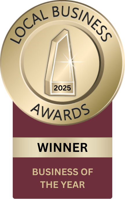 Local Business Awards medal with “Winner” and “Business of the Year” on maroon background