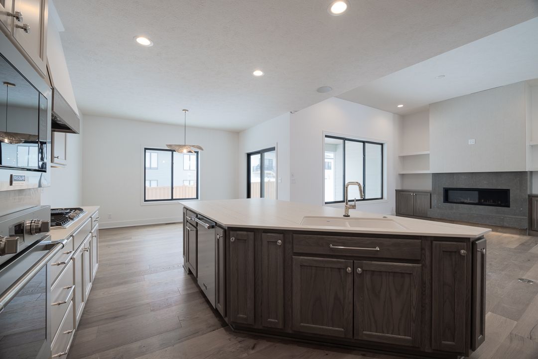 Modern Kitchen With Gray Island And Cabinets
