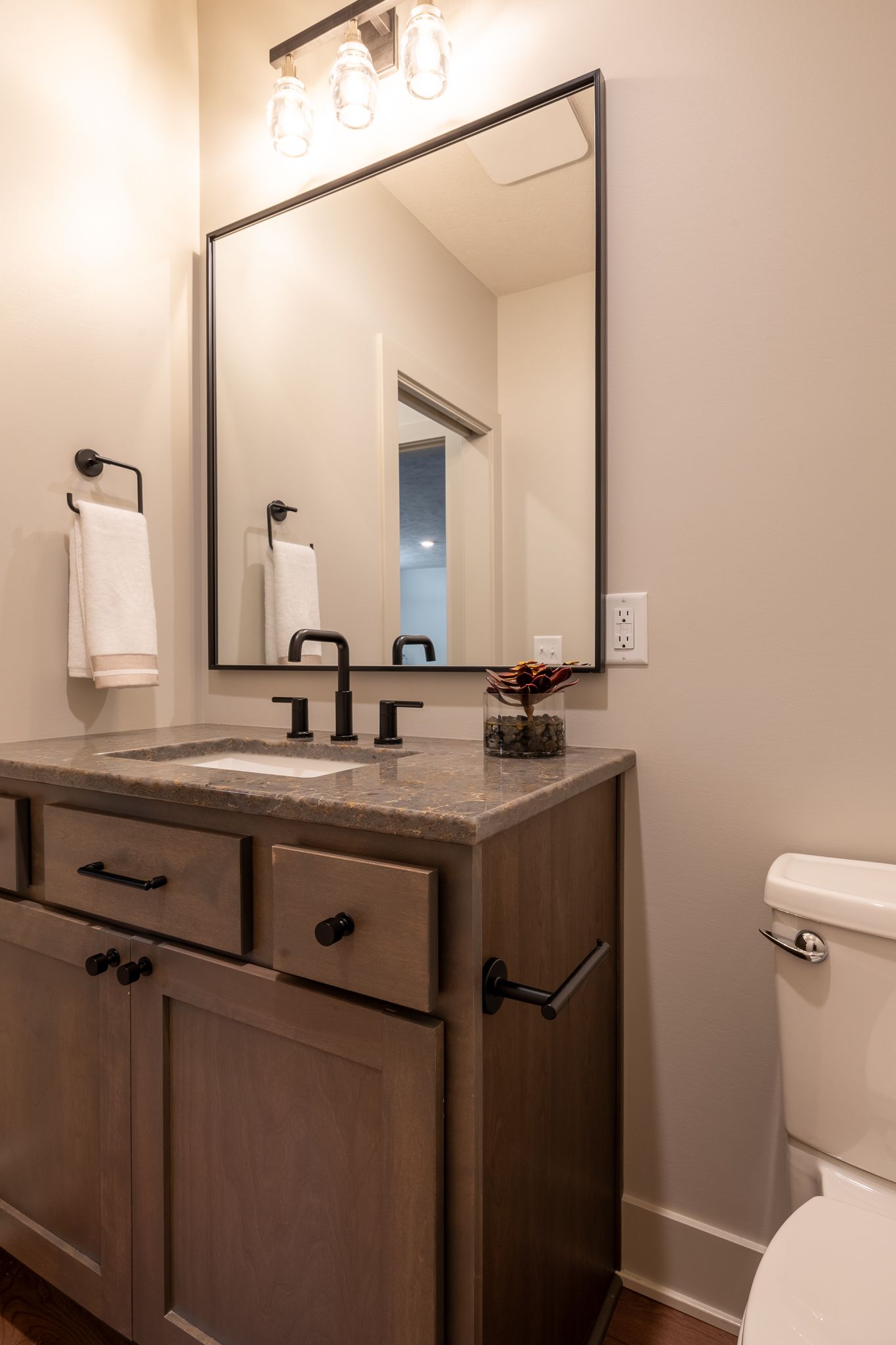 Powder Room With Vanity, Mirror, And Toilet
