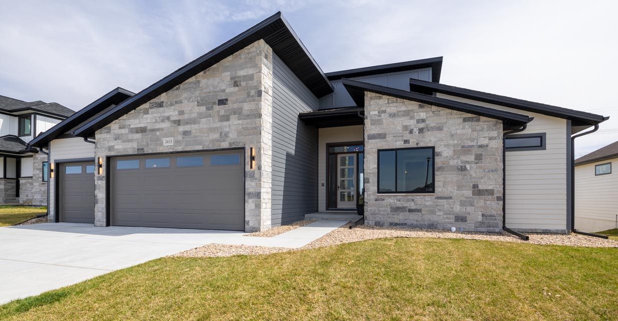 Modern House With Stone Exterior And Garage
