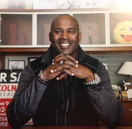 Smiling Black Man With Clasped Hands. Smiling Black Man With Clasped Hands.