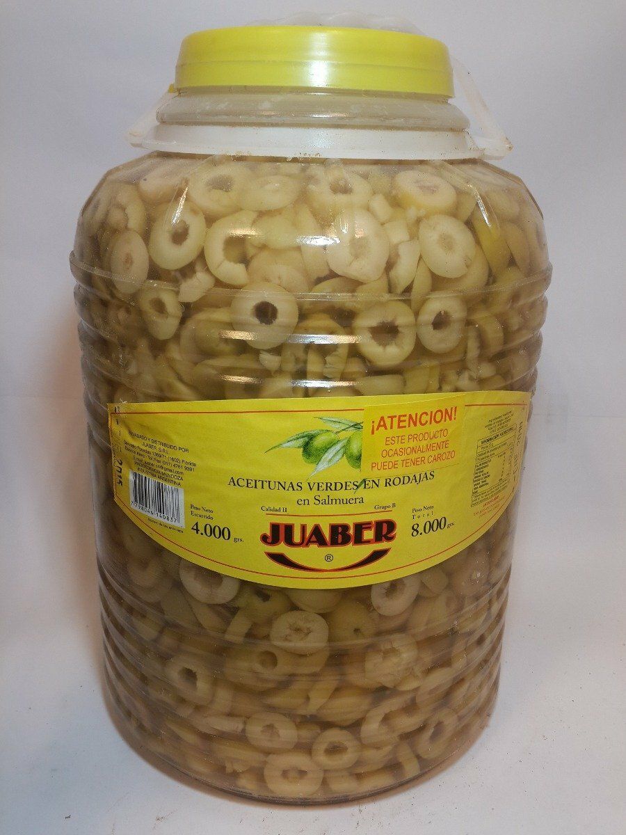 Tarro de plástico transparente con aperitivos en forma de anillo, etiqueta y tapa amarillas.