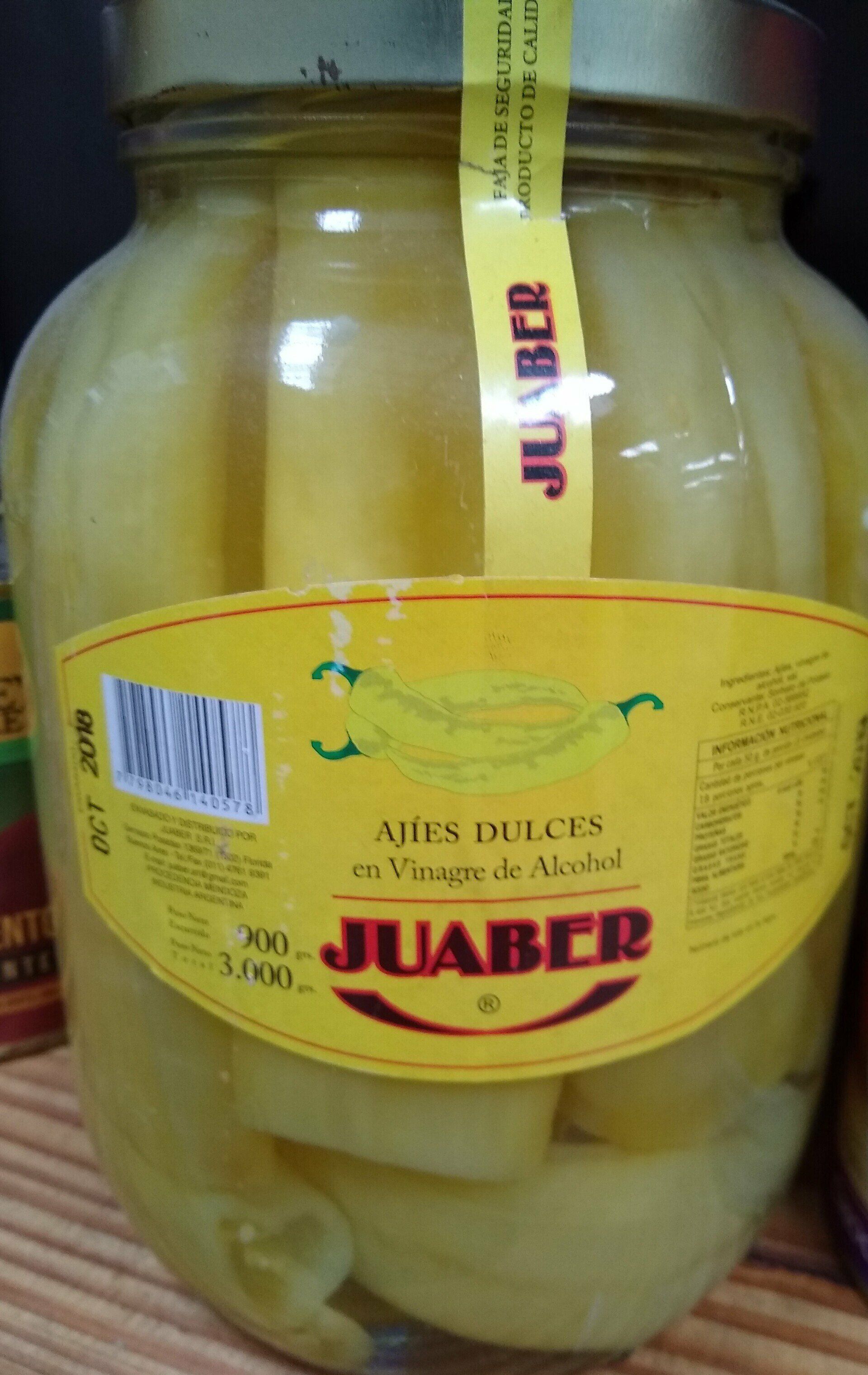 Frasco de rodajas de manzana encurtidas con etiqueta amarilla y la marca roja “JUABER”.