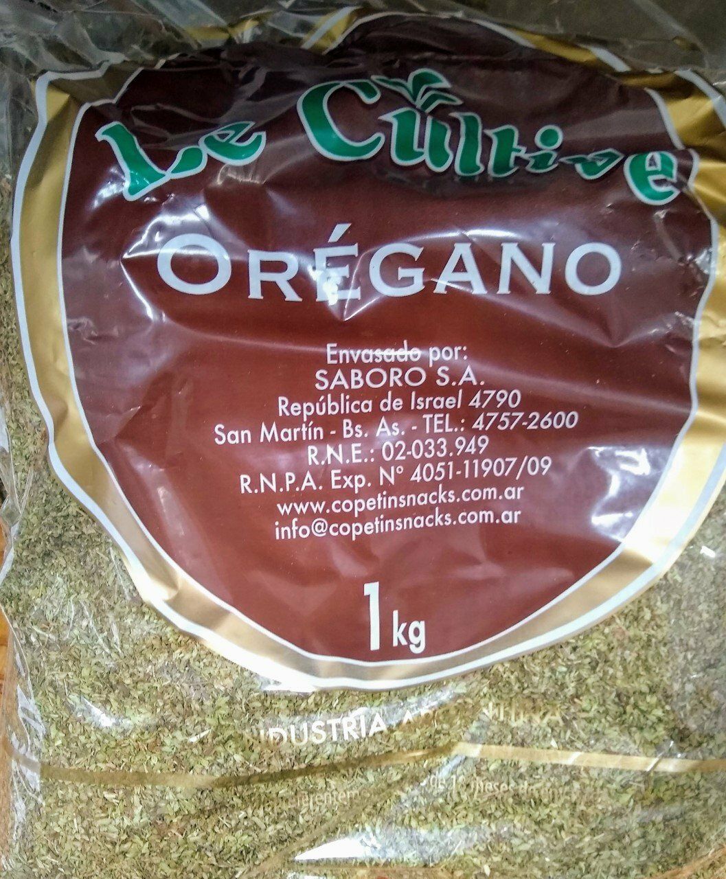 Bolsa de orégano seco con etiqueta marrón y envase de plástico transparente, 1 kg