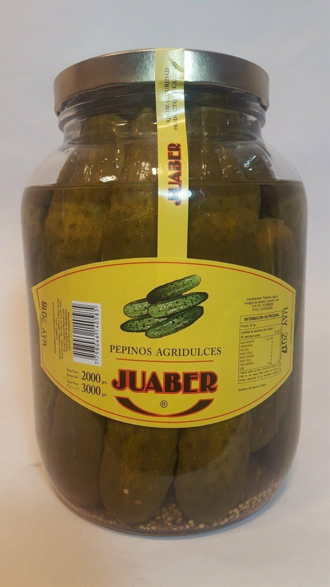Frasco de pimientos verdes encurtidos con etiqueta amarilla y tapa marrón.