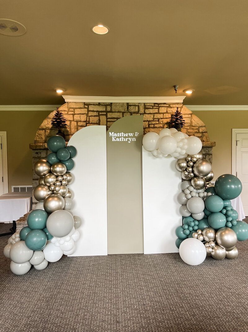 a room filled with balloons and a white wall