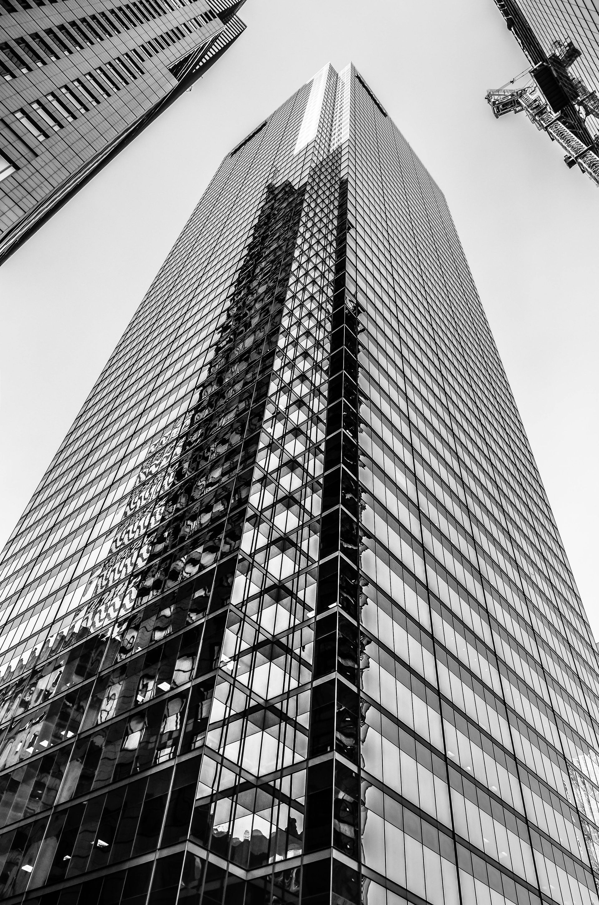 A black and white photo of a very tall building