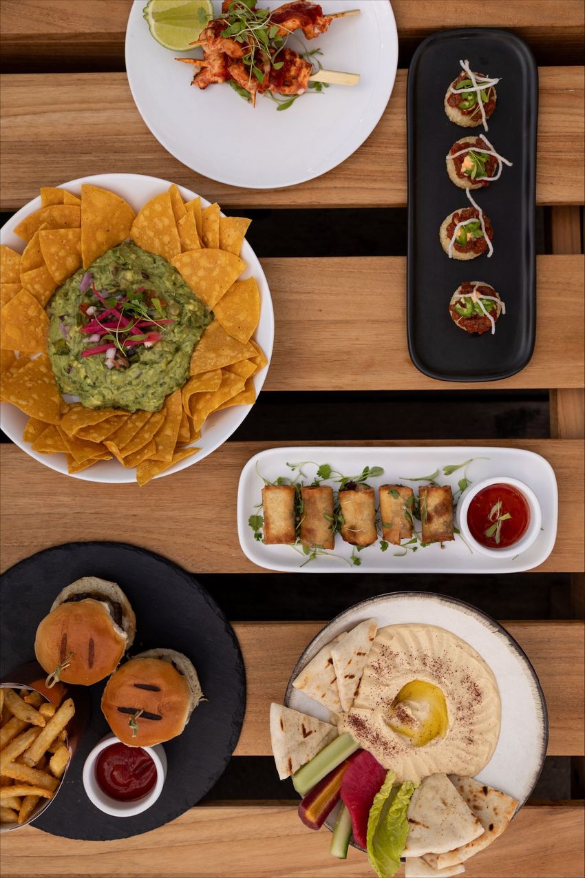 A table topped with bowls of food and drinks.