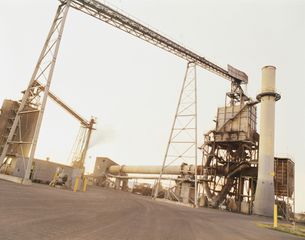 A large factory with a lot of pipes going through it