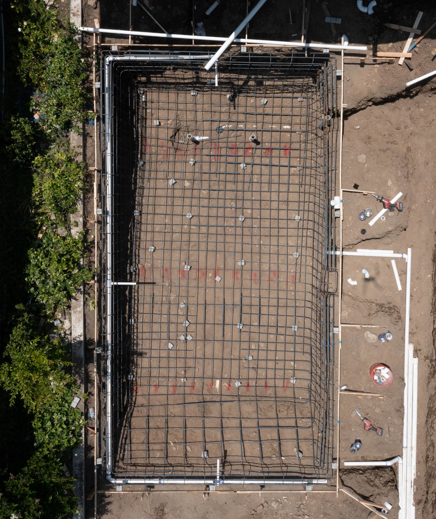 Modul Pools. Excavation, steel, and plumbing phase.