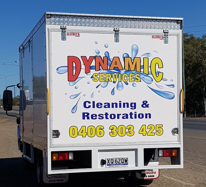 Rear view of a white box truck with 