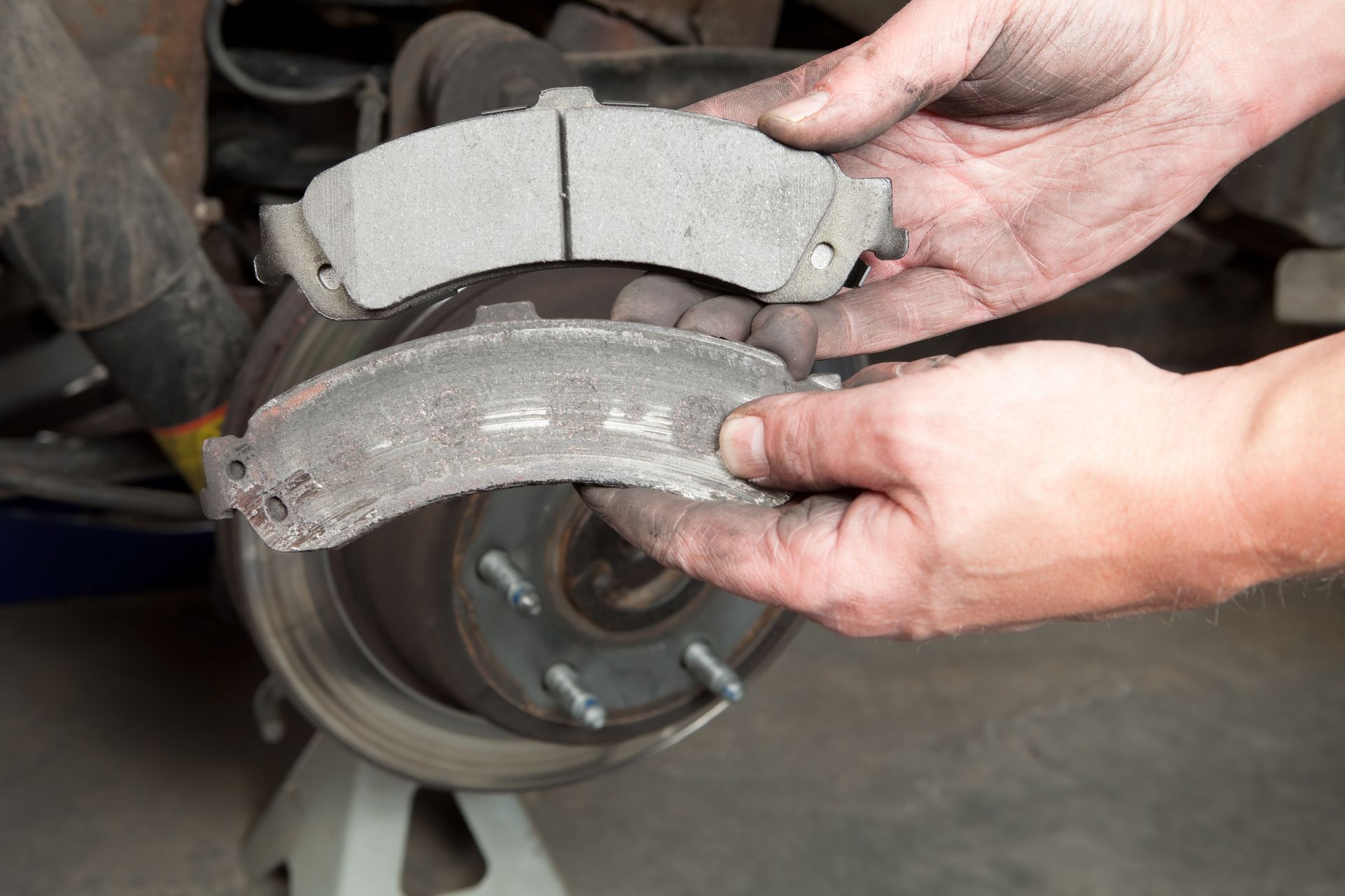 A close-up of a new metal brake pad.