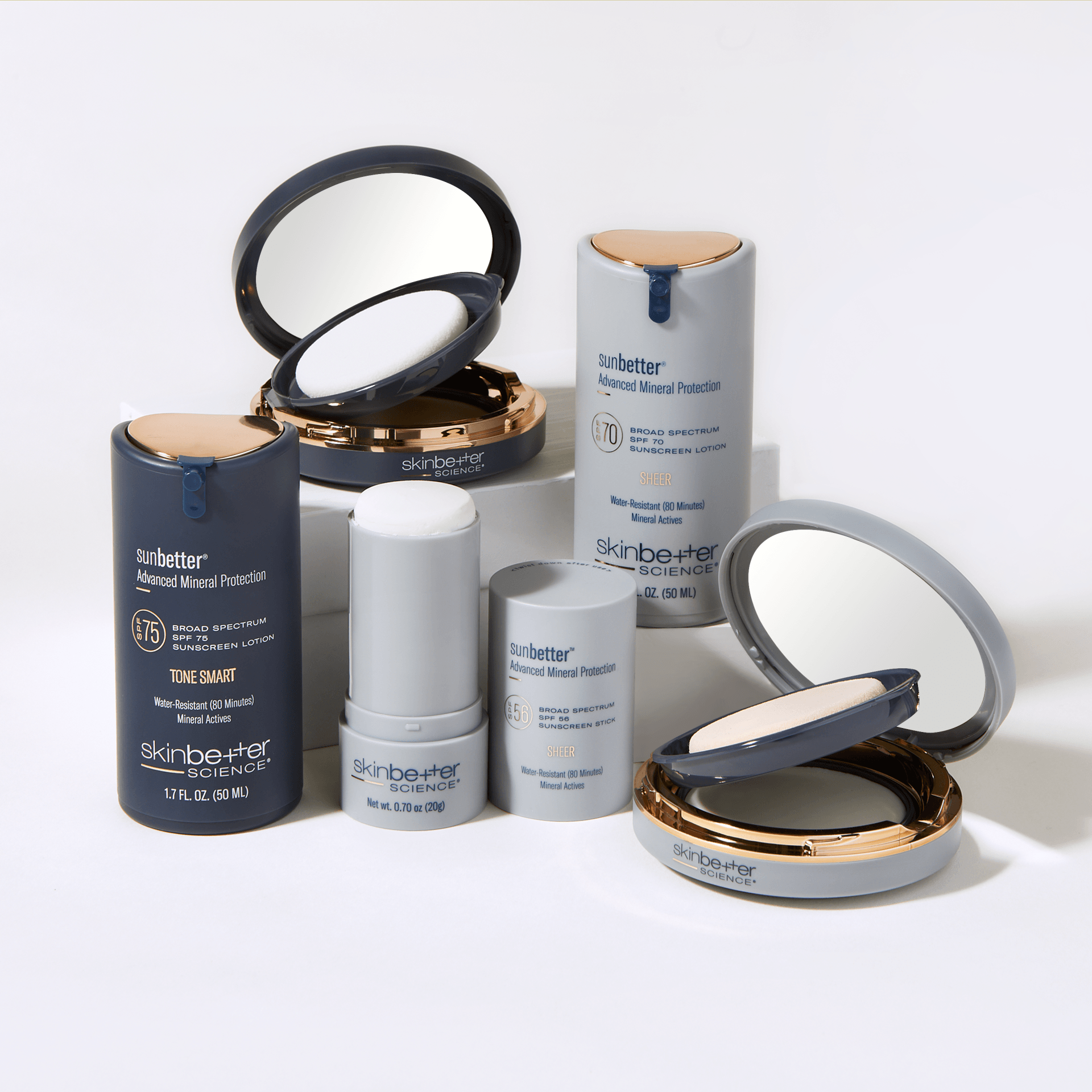 A group of cosmetics sitting on top of each other on a table.SPF SkinBetter Science 
