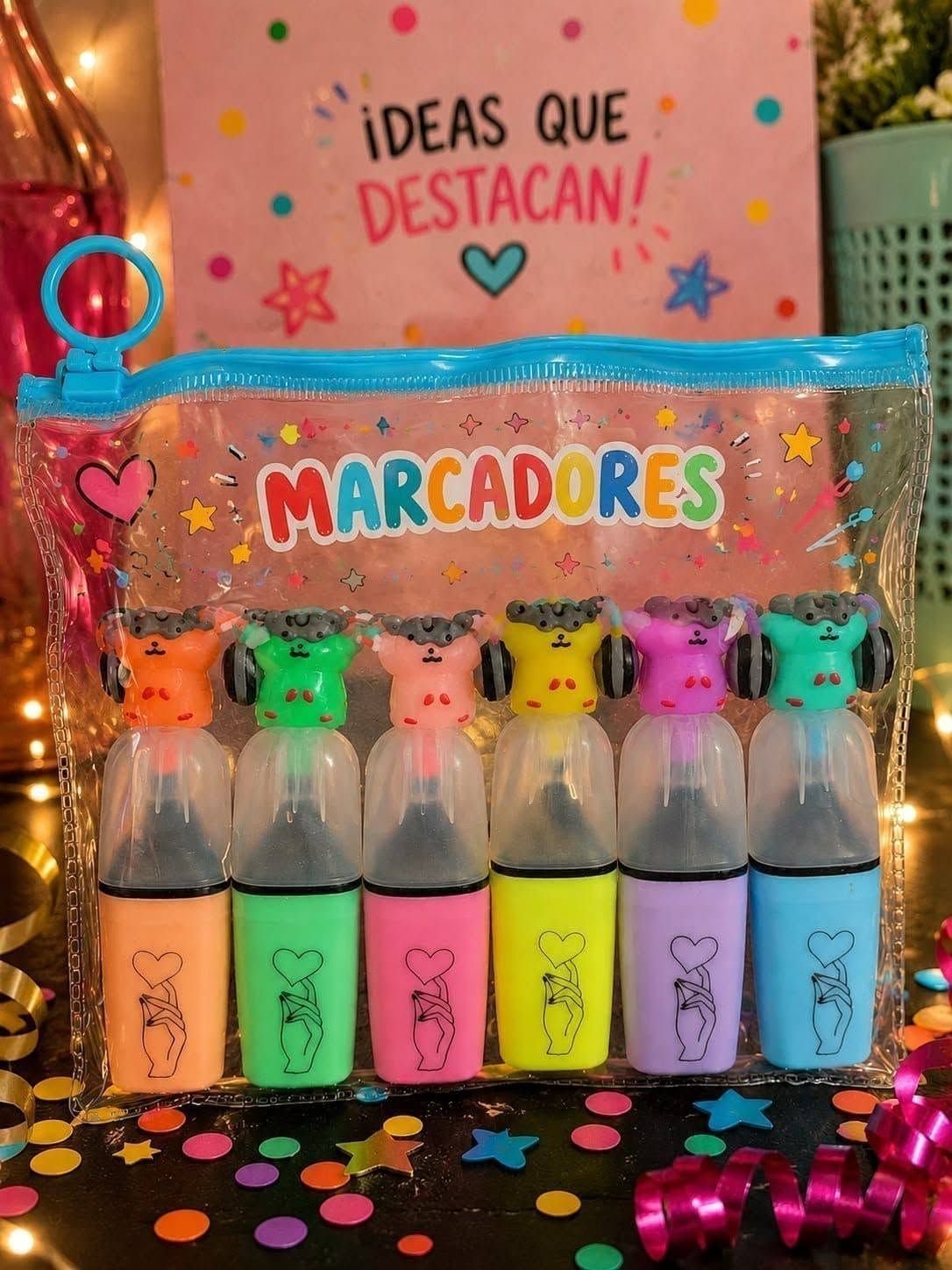 Set de rotuladores de colores en un estuche transparente, etiquetado como «Marcadores», con tapones de neón.