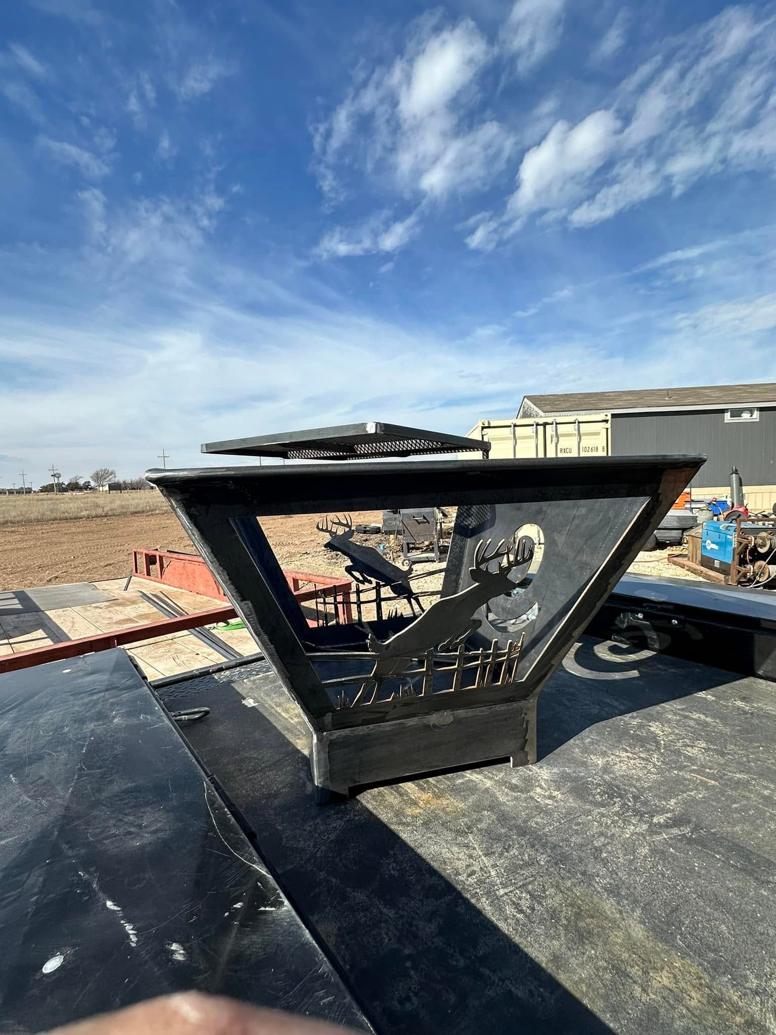 Rooftop skylight with shattered glass and debris under a blue sky, next to a tan building.