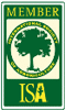 A green and white sign with a tree in a circle and the words `` member isa ''.