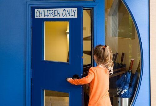 Montessori child entering a classroom