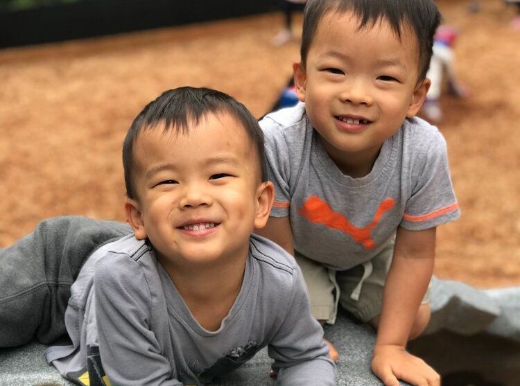 Montessori children smiling at the camera