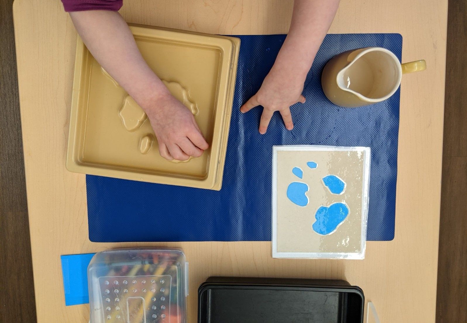Child working with Montessori materials