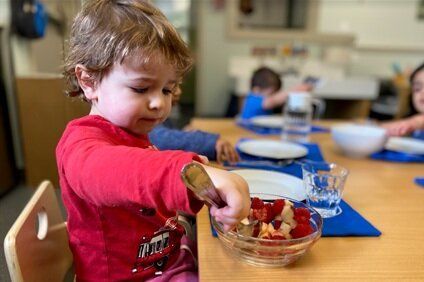 Montessori child working on practical life skills