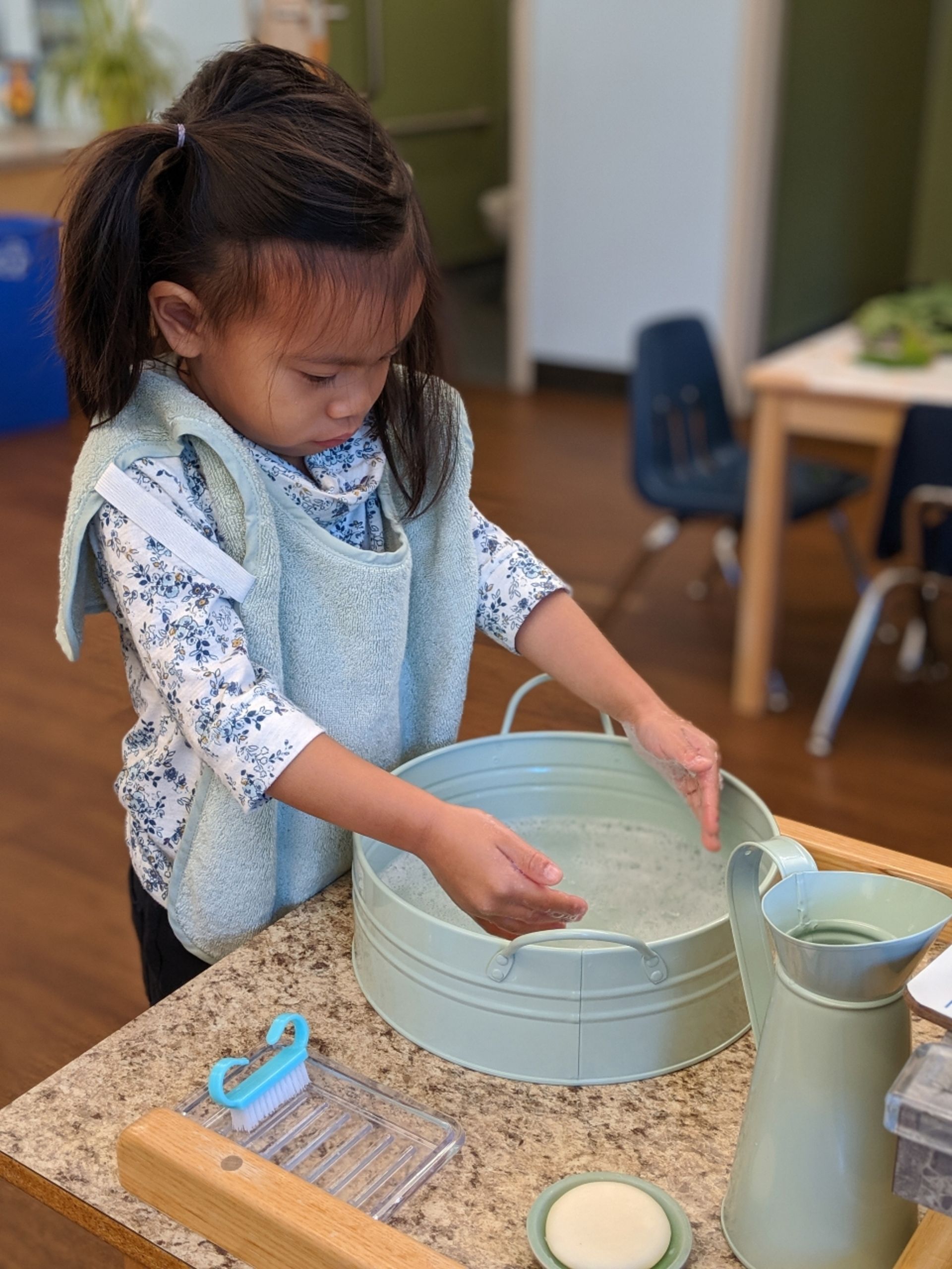 Montessori child working on practical life skills
