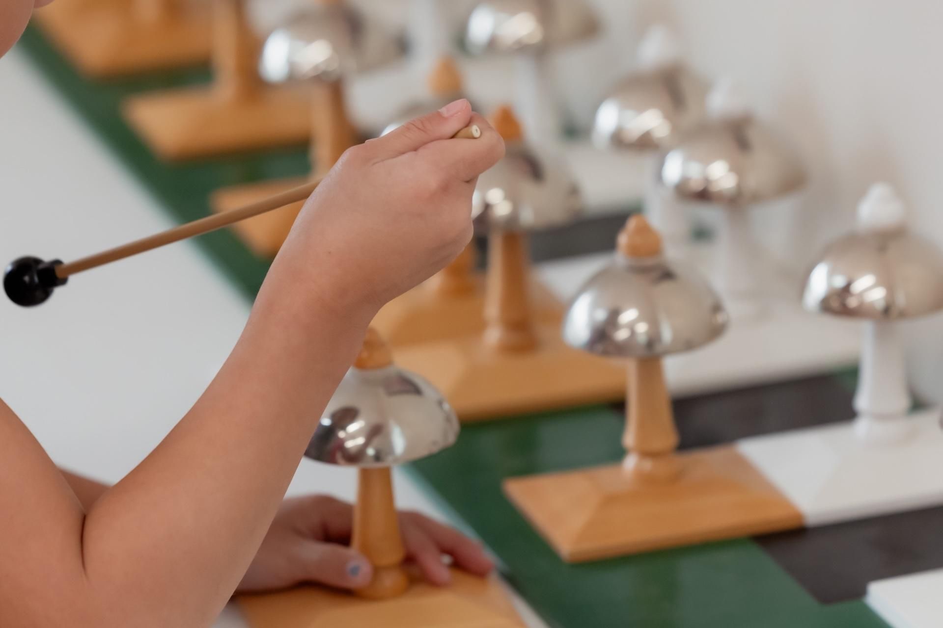 Montessori child painting a world map