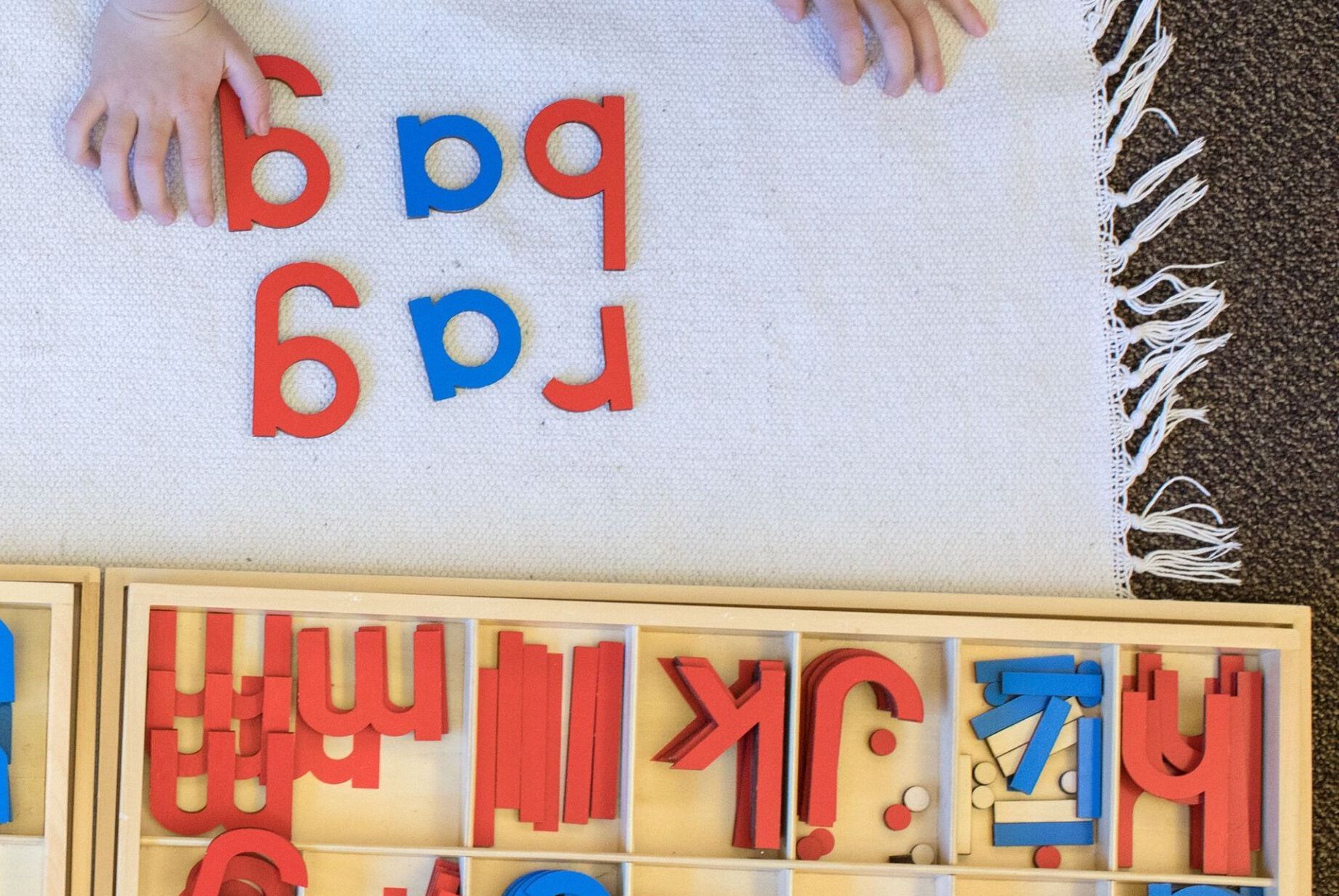 Child working with a Montessori materials