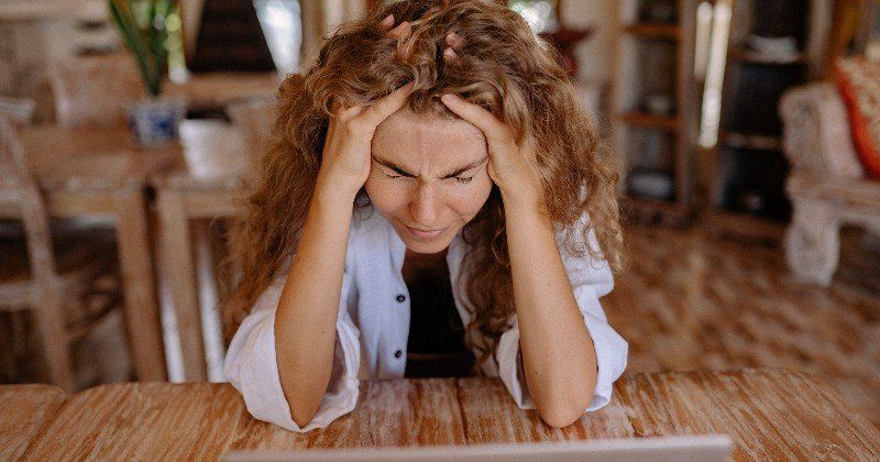 Woman experiencing stress in her job