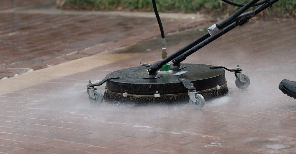 Pressure Washer Cleaning Red Brick Pavement — Cairns Bin Cleaning In Parramatta Park, QLD