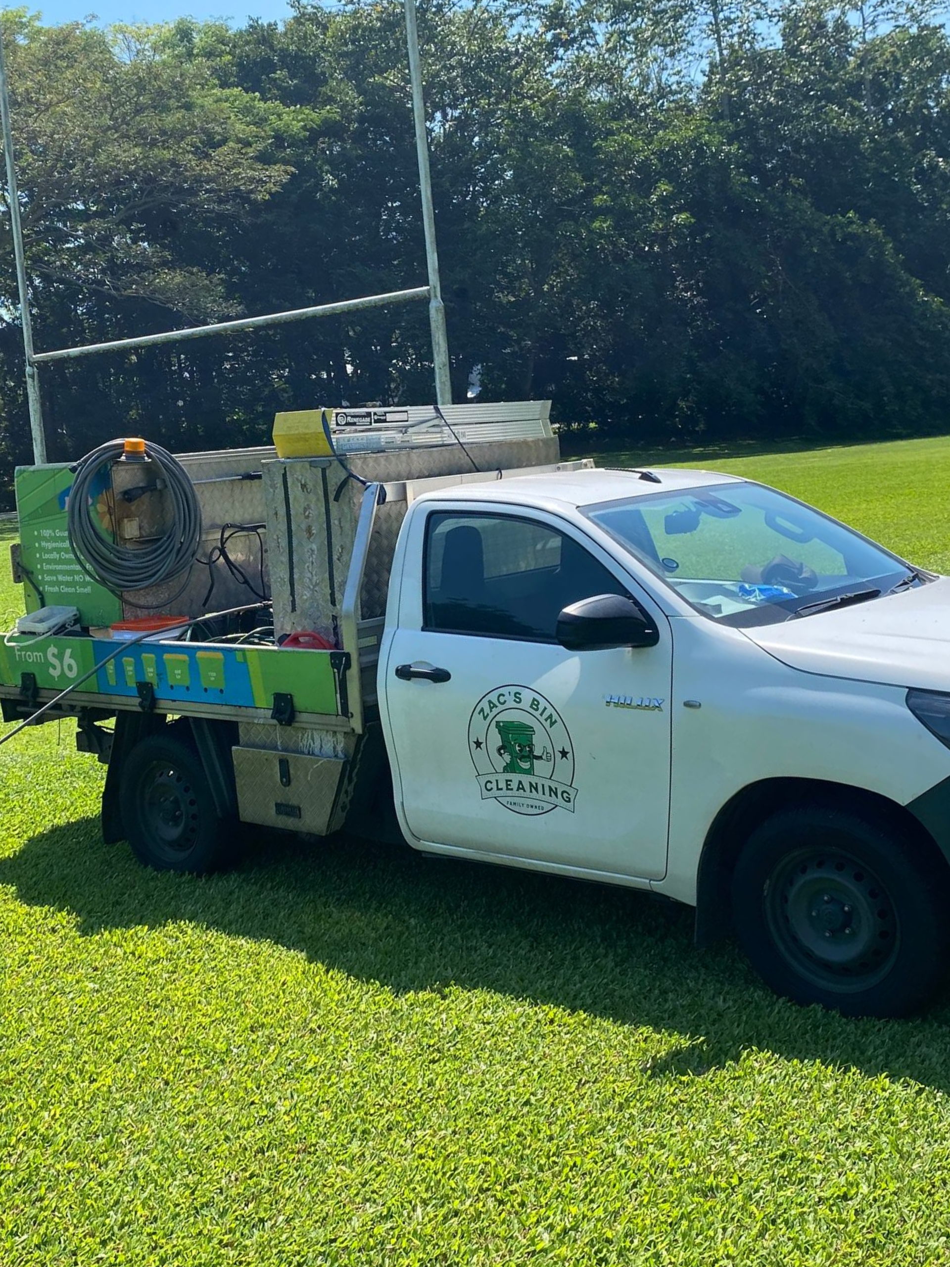 A Person Is Cleaning A Roof With A High Pressure Washer — Cairns Bin Cleaning In Parramatta Park, QLD